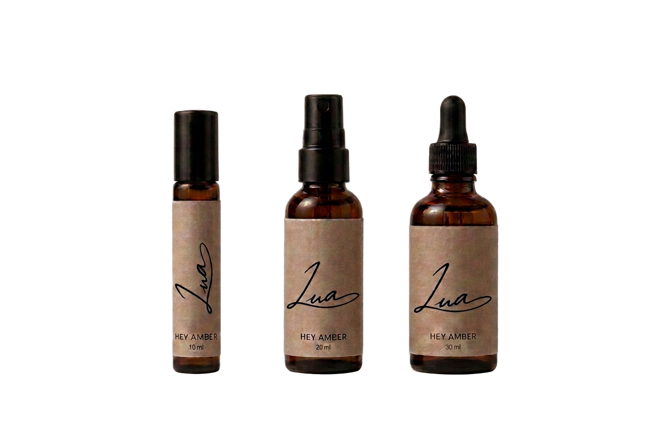 Hey Amber perfume oil in roller, dropper and elixir bottles